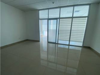 Empty commercial office with glass windows, tiled floor in Plaza Korintho El Carmen Panama