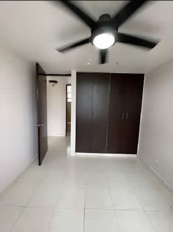 Outdoor children playground with slides, rubber matting, surrounded by buildings PH Villa de las Fuentes Panama