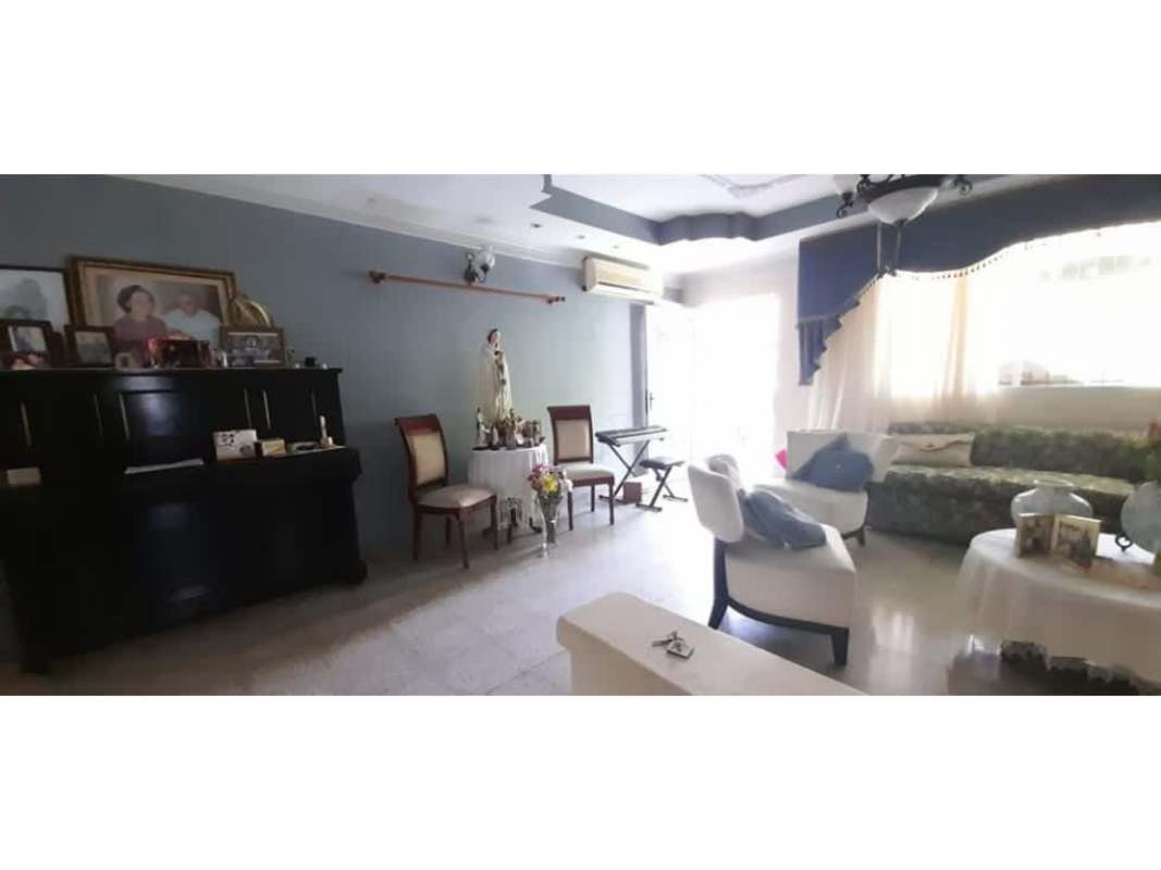 Spacious living room with large windows and traditional decor in Panamanian house