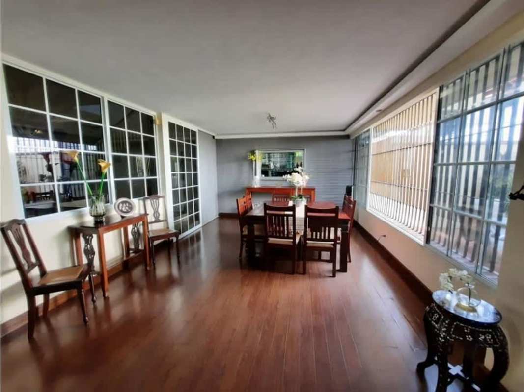 Kitchen with granite counters, traditional white cabinets, stainless appliances in La Alameda Panama