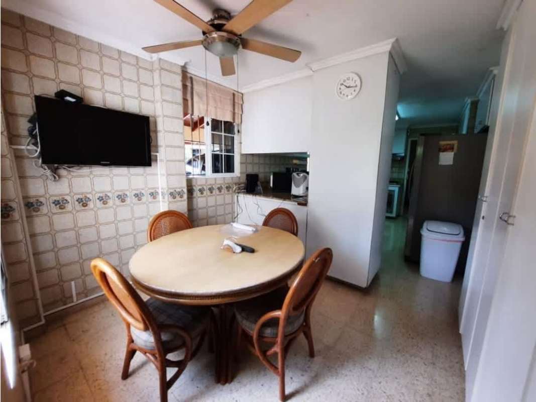 Traditional dining space with wood floors and bright windows La Alameda Panama