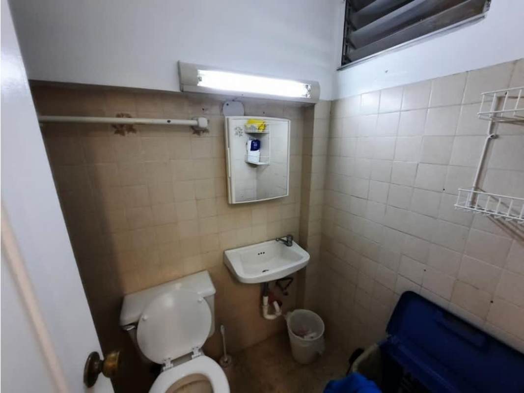 Bedroom with vaulted cedar ceiling, AC unit, windows, airy design in La Alameda Panama