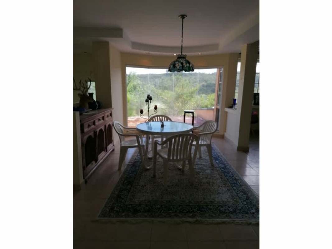 Dining area with large windows overlooking nature, traditional style, Cerro Azul Panama