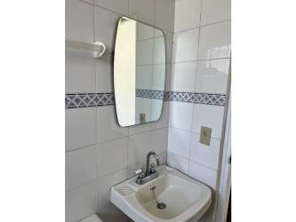 Kitchen with breakfast bar, wooden stools, natural light in Punta Barco Coronado beach property