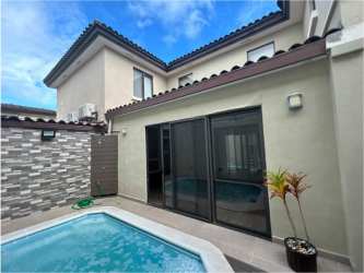 Modern kitchen with island bar and stainless appliances Panama Pacifico luxury house for sale