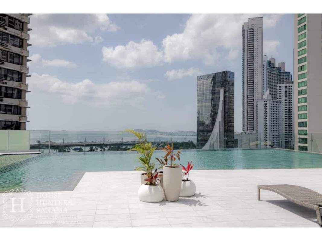 Rooftop infinity pool overlooking Panama skyline and Pacific Ocean at PH Costanera