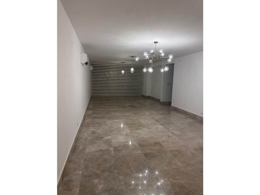 Modern apartment living room with large windows and sea view in PH Costanera Bella Vista