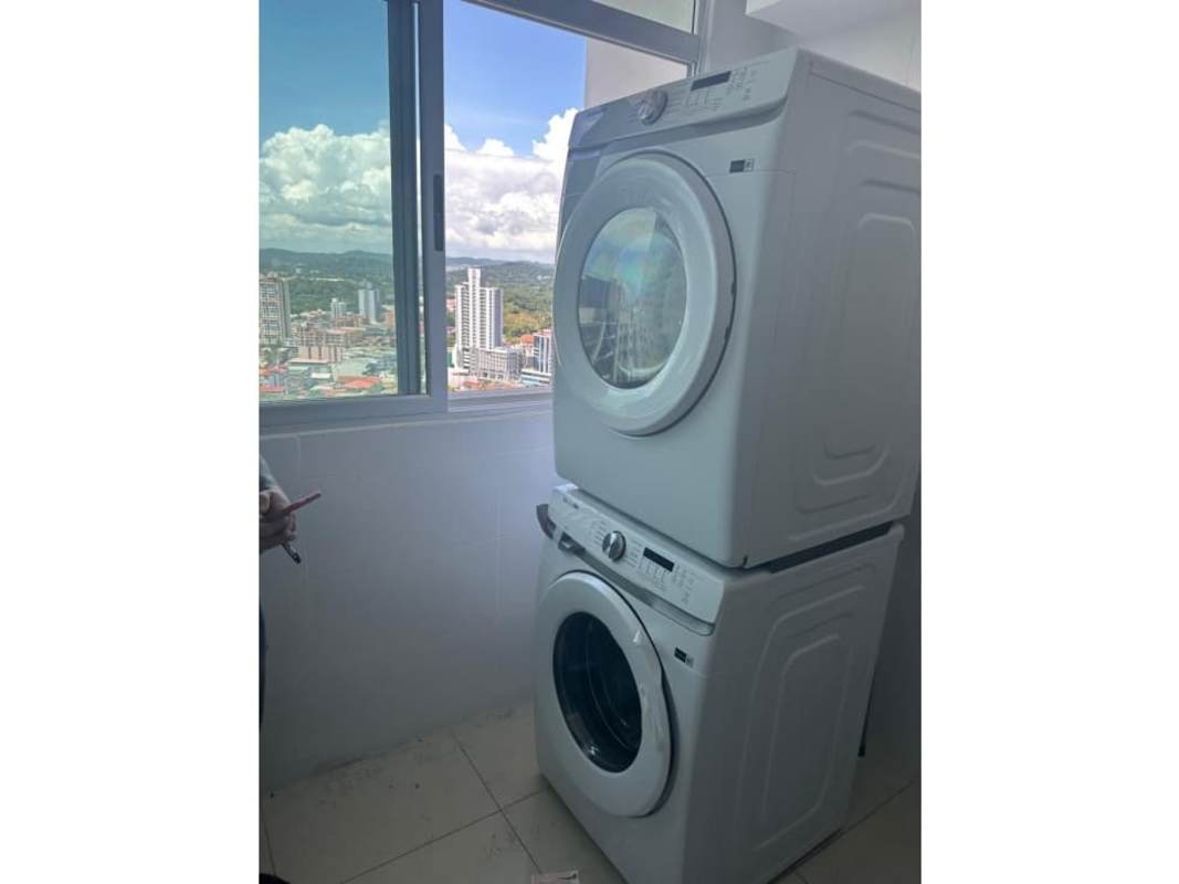 Contemporary kitchen with granite counters and appliances at PH Costanera Panama City