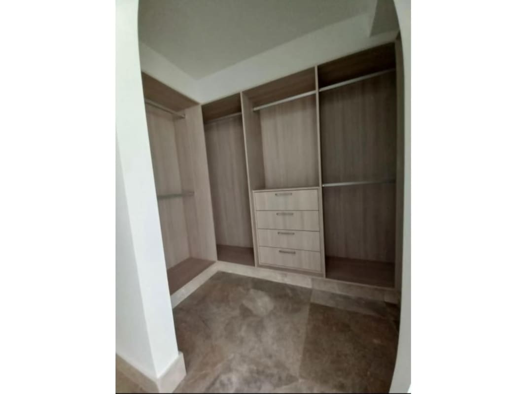 Spacious master bedroom with closet and ocean city views at PH Costanera Bella Vista Panama