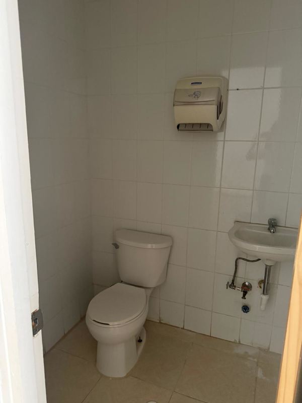 Functional bathroom with white tile, sink, toilet in Marbella commercial rental Panama City