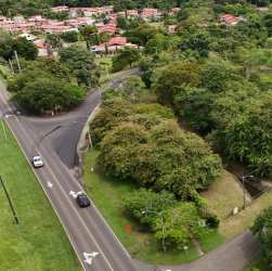 Aerial view of intersection with lush green surroundings near Panama Pacifico