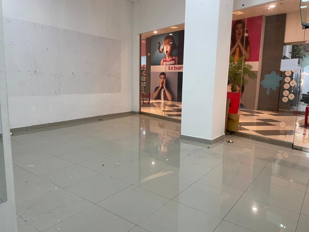 Front entrance of retail unit with glass wall and display at Dorado Mall shopping center Panama City