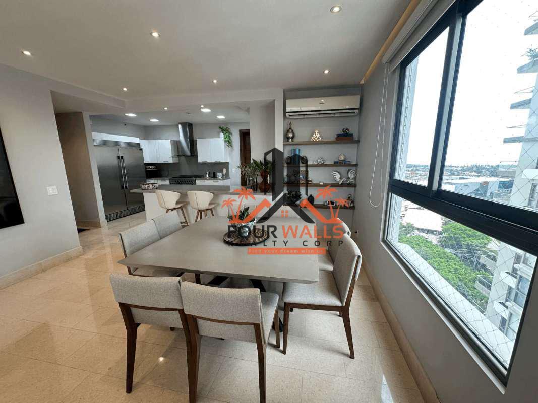 Contemporary living room with panoramic windows and skyline view PH Green View Santa María Panama