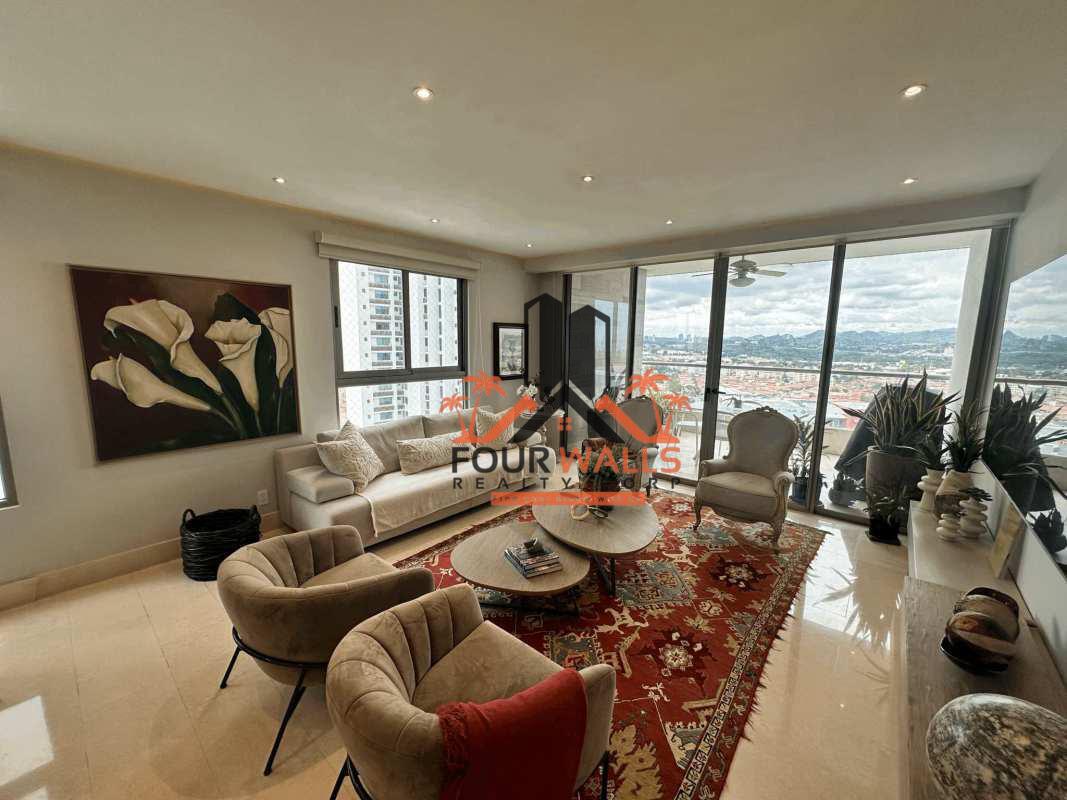 Contemporary kitchen design with island and stainless refrigerator in PH Green View Santa María Panama