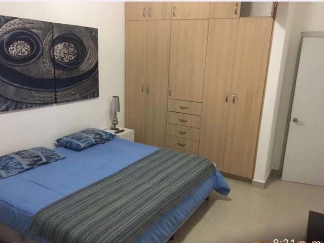 Contemporary bedroom with wardrobe and minimalist decor in PH Astoria El Cangrejo Panama City