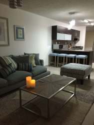 Open-plan living room with kitchen bar stools PH Vista Marina San Carlos Panama