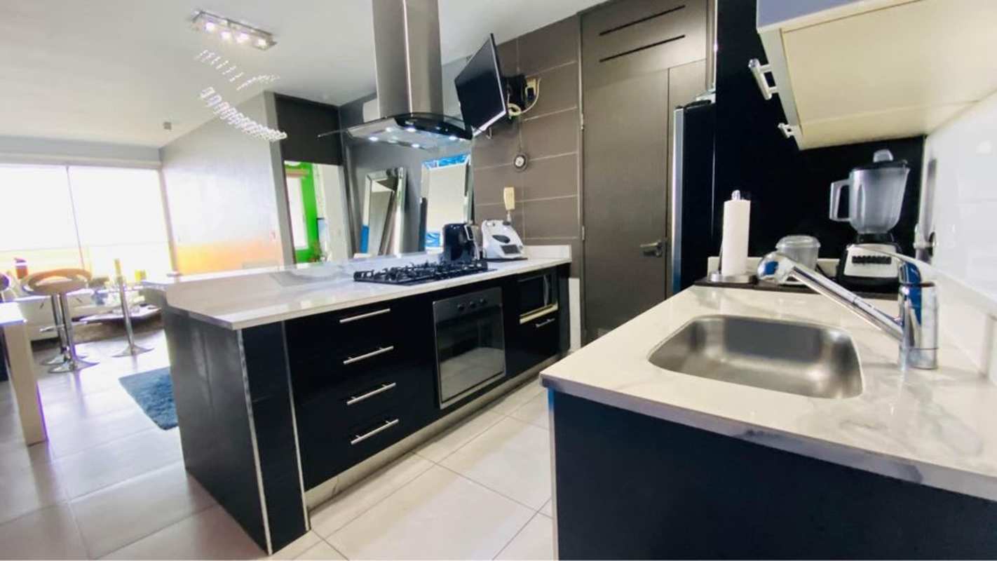 Contemporary kitchen with appliances included inside PH BICSA apartment on Avenida Balboa Panama City