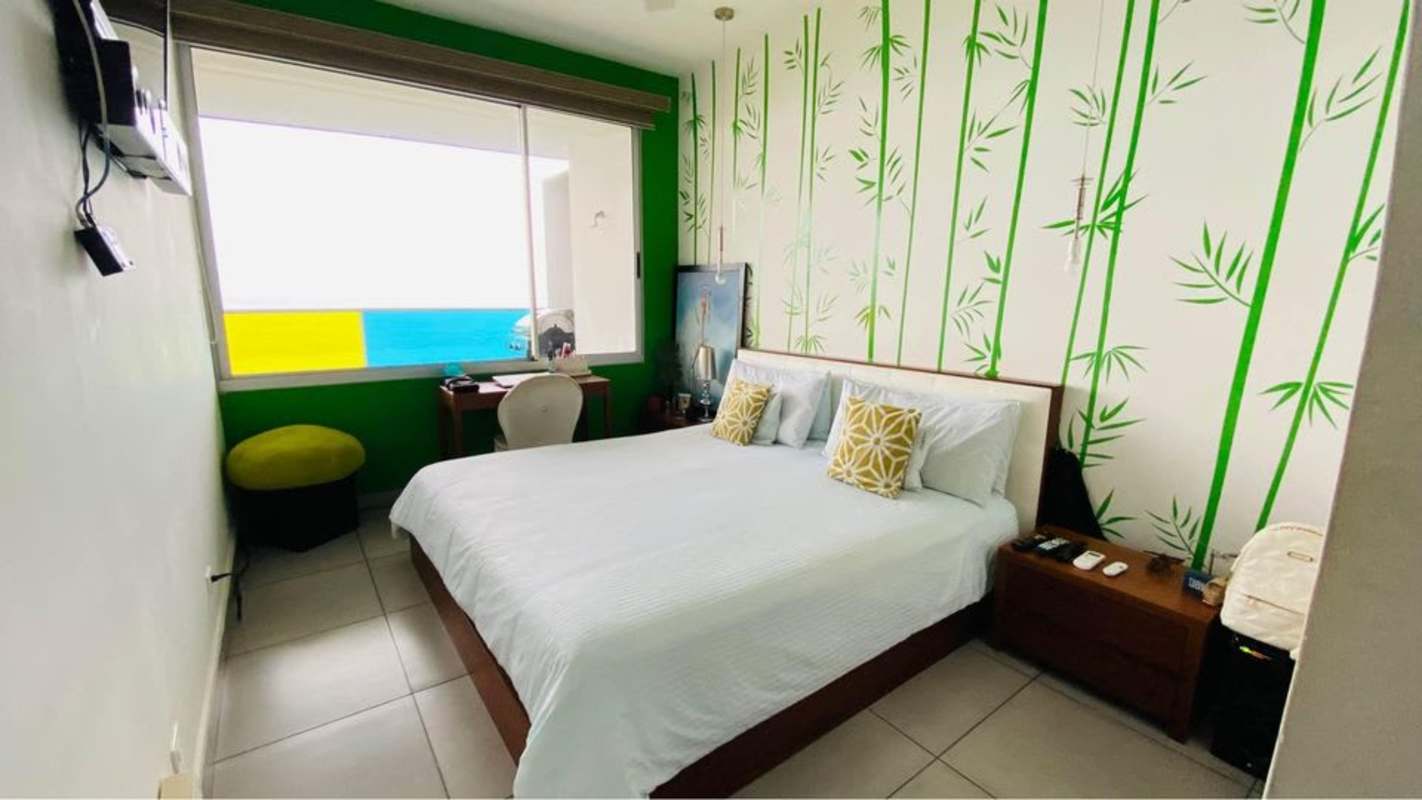 Modern dining space with large windows, bright natural light PH BICSA apartment Panama City