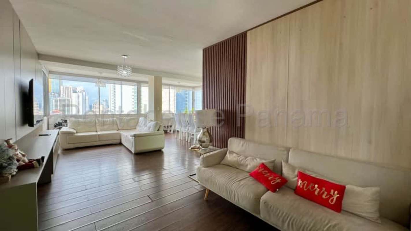 Dining and spacious living area with large windows in PH Plaza Paitilla apartment Panama