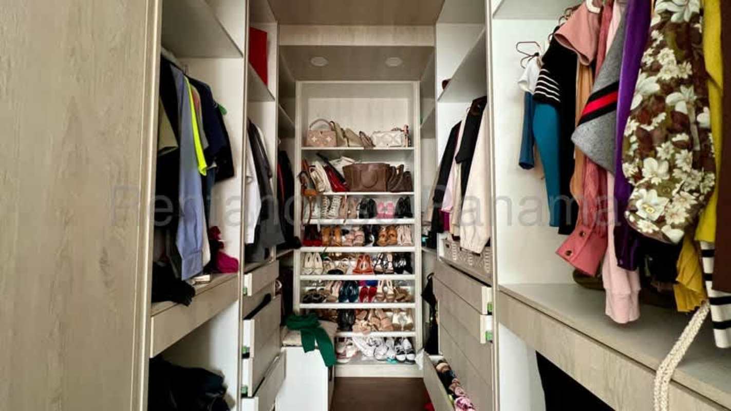 Bedroom with panoramic city views large window at PH Plaza Paitilla condo Panama