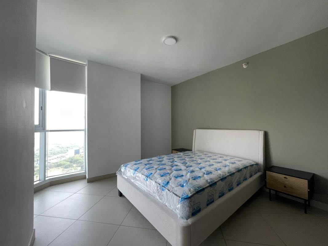Elegant master bedroom large windows panoramic city skyline views PH Riverside Costa del Este Panama