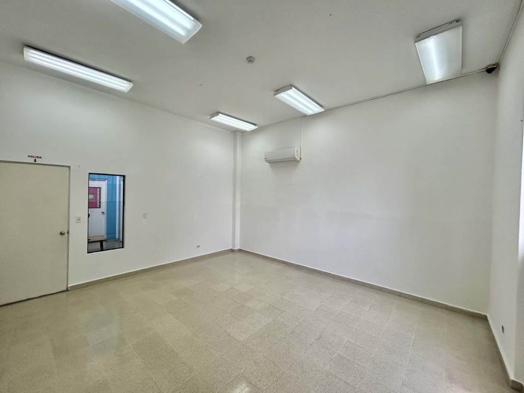 Minimalist interior commercial unit with fluorescent lighting, high ceiling, Costa del Este Panama