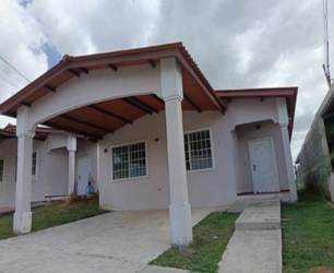 Covered two-car carport and front windows with security bars in suburban Panama Arraiján
