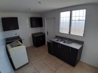Laundry room with utility sink and window natural light in Brisas del Golf Arraiján