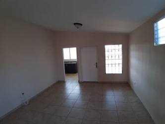 Unfurnished living space with ceramic tile floor and neutral walls in Brisas del Golf Arraiján home