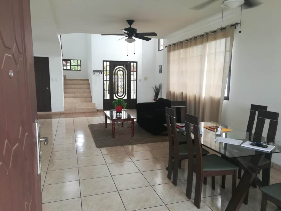 Kitchen with wood cabinetry, granite counters, stainless steel appliances in remodeled house Brisas del Golf Panama