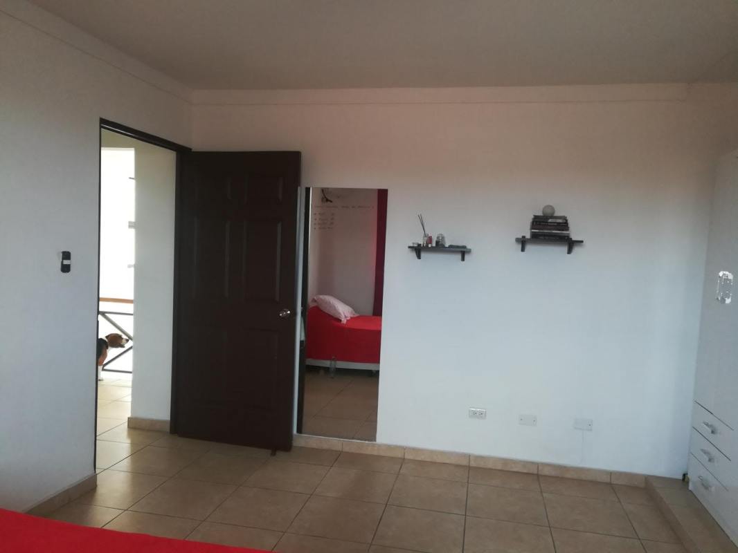 Covered terrace patio with ceiling fan in remodeled home Brisas del Golf Panama