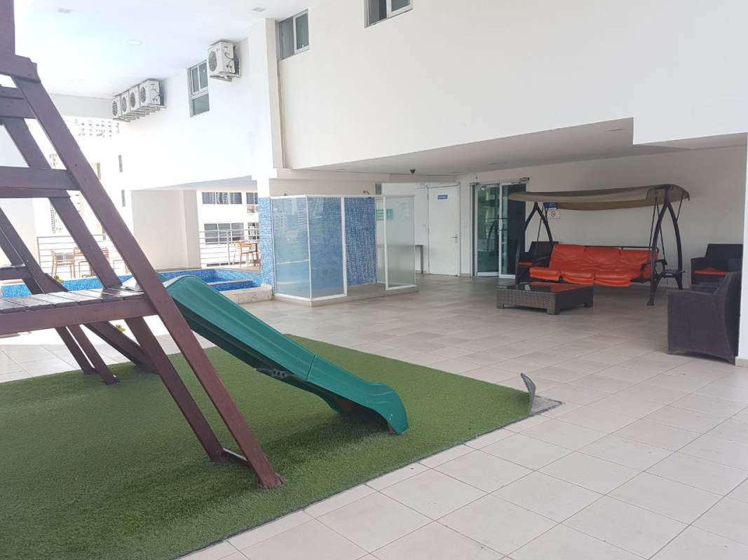 Indoor children's play area with playground equipment and seating at PH Latorraca Panama