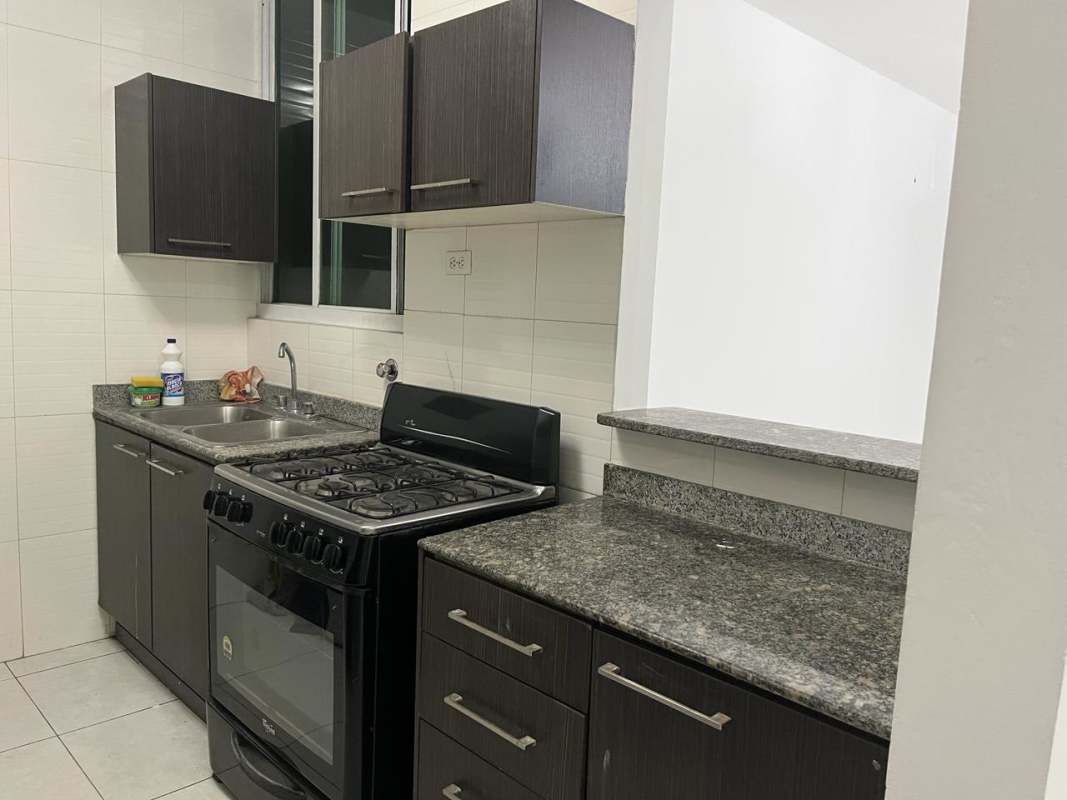 Modern kitchen with granite countertop and appliances in Edison Park Panama City