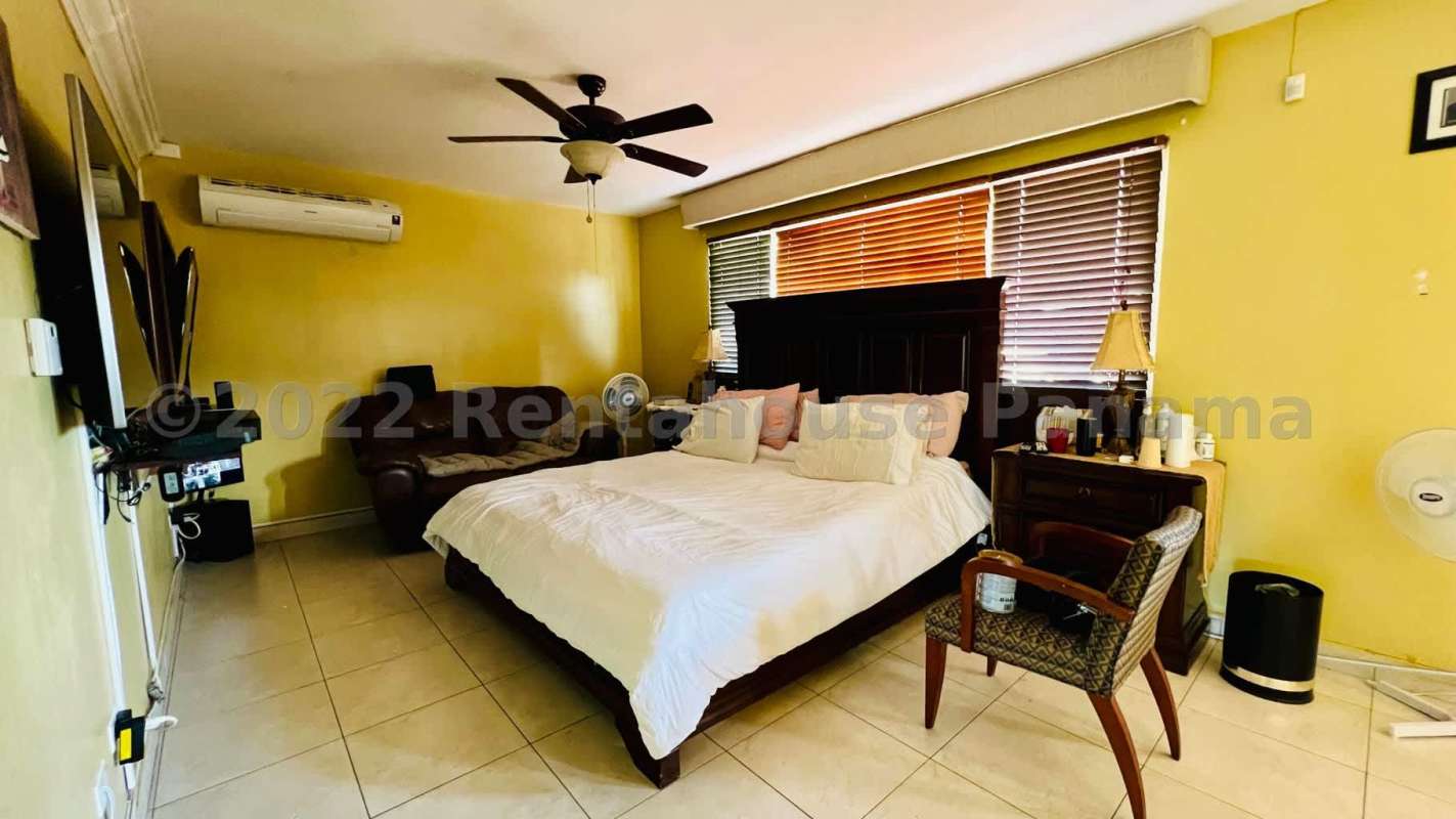 Bright spacious living and dining room with large windows overlooking private garden Panama