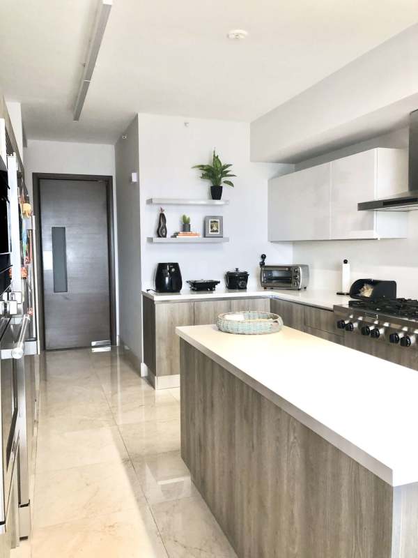 Contemporary kitchen with central island stainless appliances luxury condo Panama