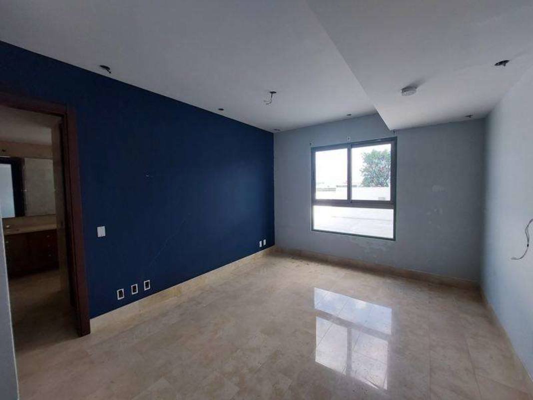 Spacious bedroom with large window marble floors adjacent bath Greenview Residences Panama