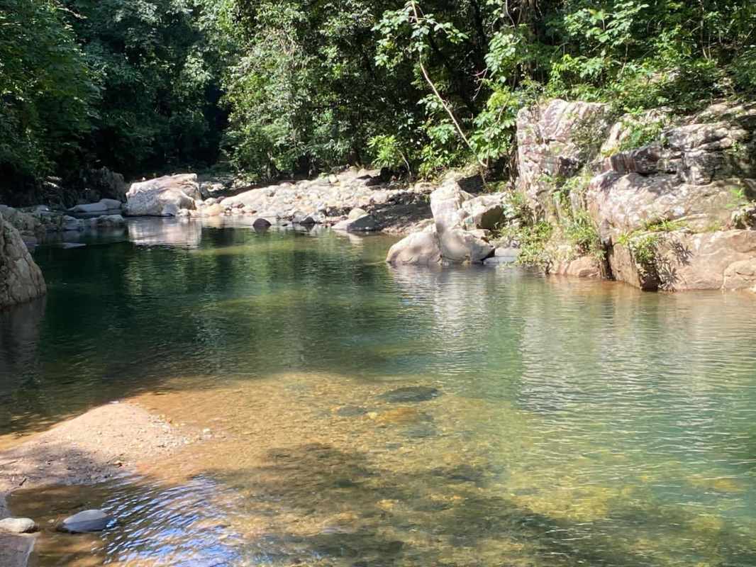 Rustic gazebo hammock mountain backdrop lush lawn Paso Blanco Panama land