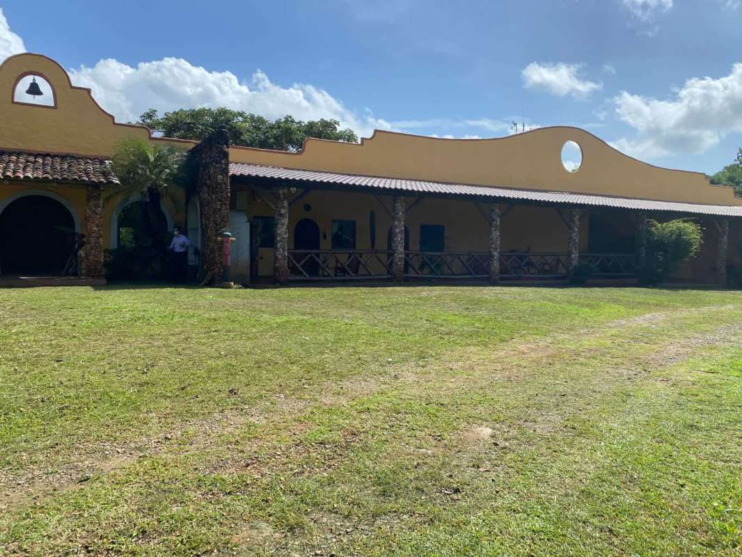 Concrete bridge rural access dirt road greenery Paso Blanco estate Pacora
