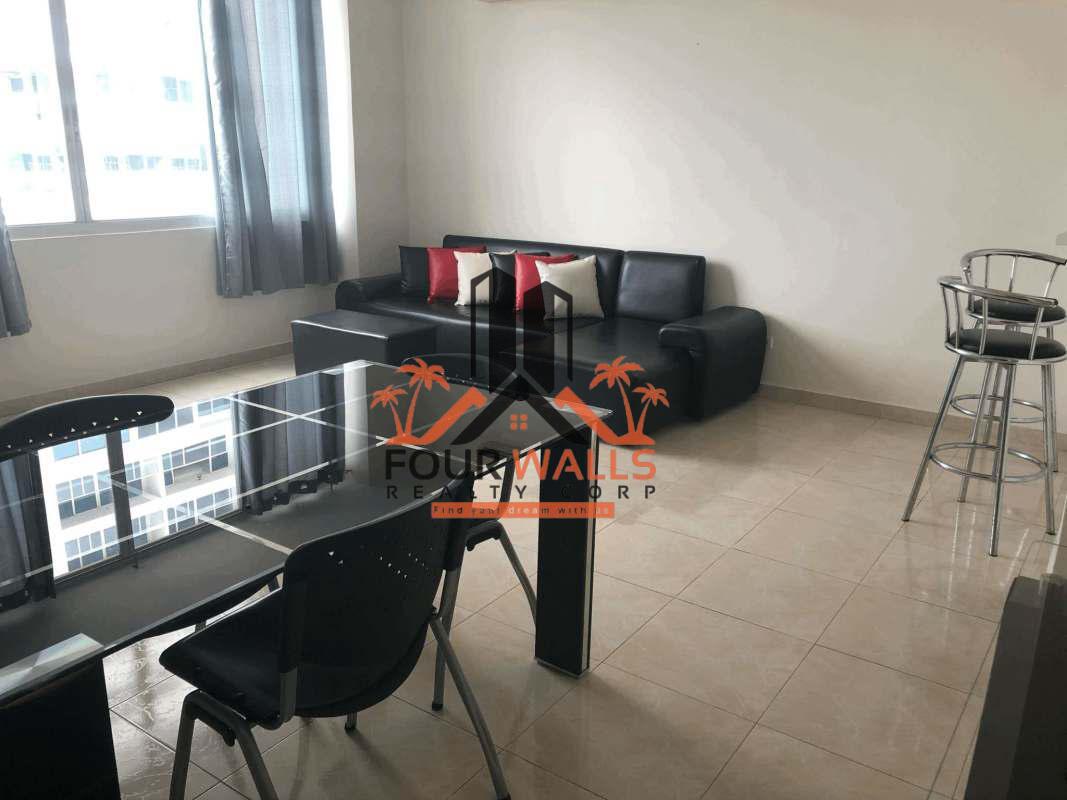 Living room with open dining and large window ceramic tile PH Vivendi Towers Edison Park Panama