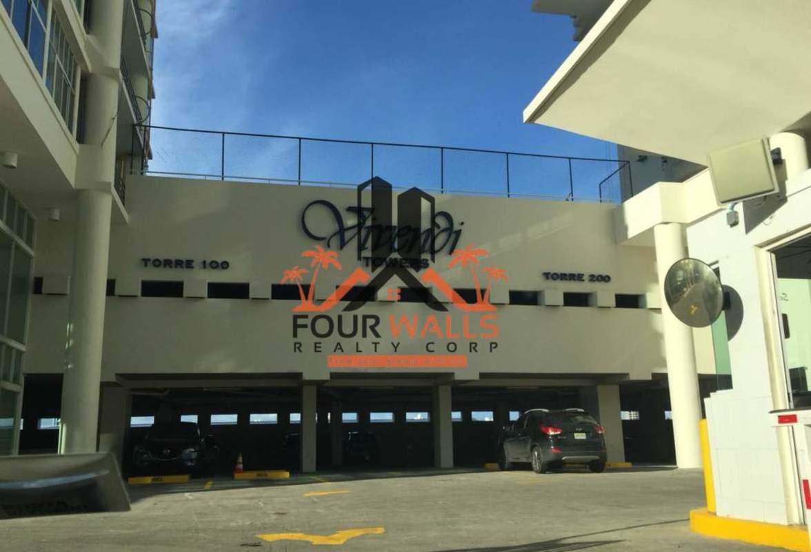 Exterior of PH Vivendi Towers condominiums Edison Park with entrance driveway and parking garage Panama City