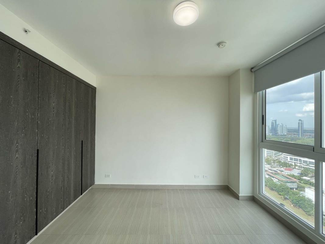 Master bedroom with large window facing ocean in PH Asia Costa del Este Panama