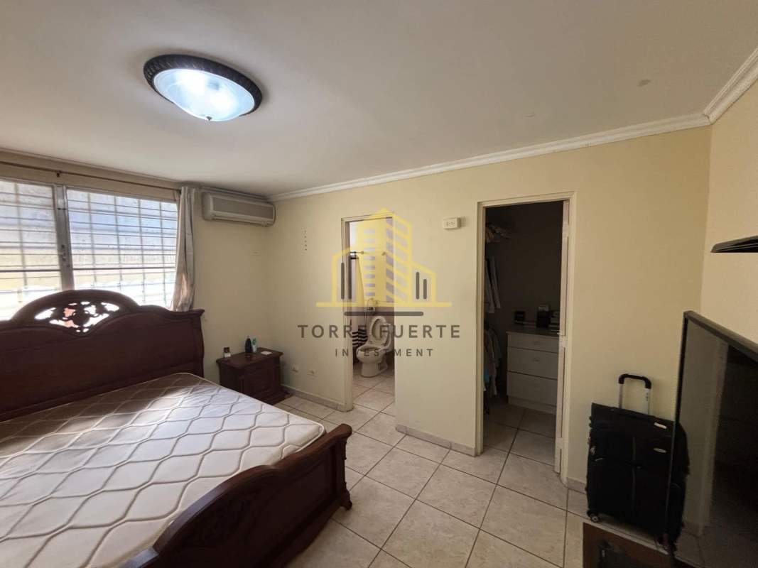 Master bedroom with walk-in closet, split AC and large window bars in Brisas del Golf Panama