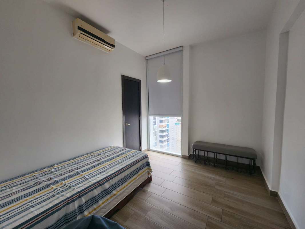 Outdoor swimming pool with sun loungers and city views at PH Quadrat San Francisco Panama City