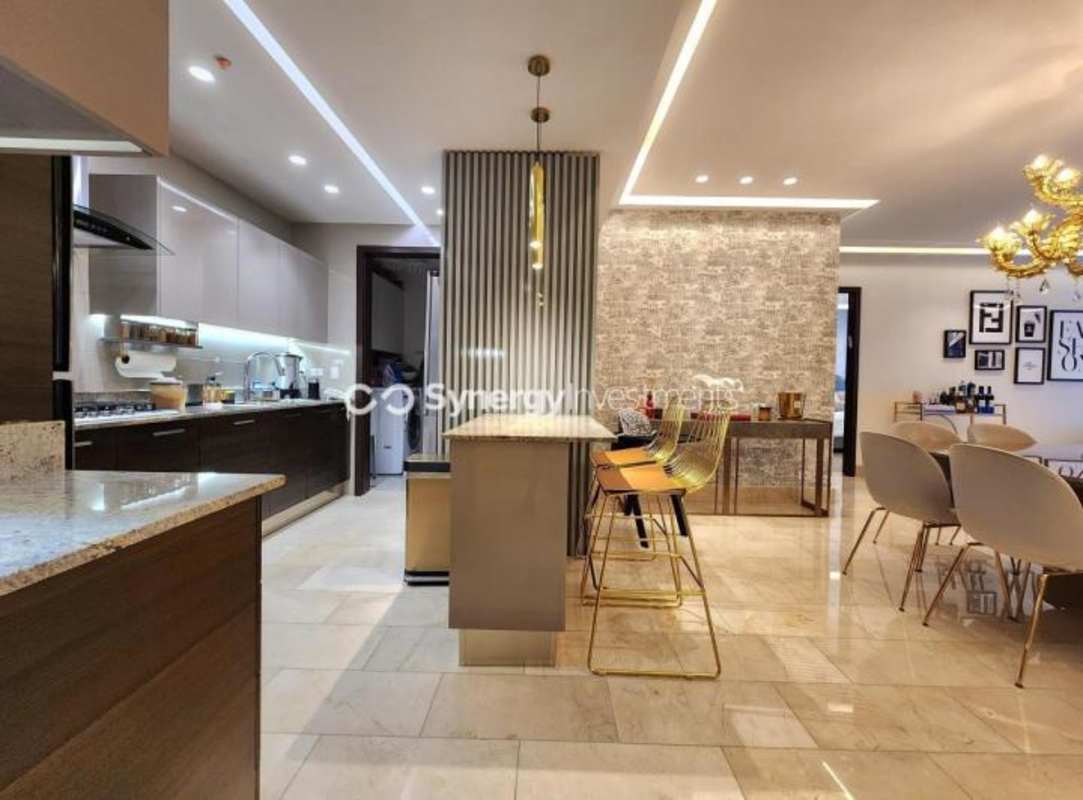 Open-plan kitchen with granite counters marble floors in PH Ocean Riviera Panama