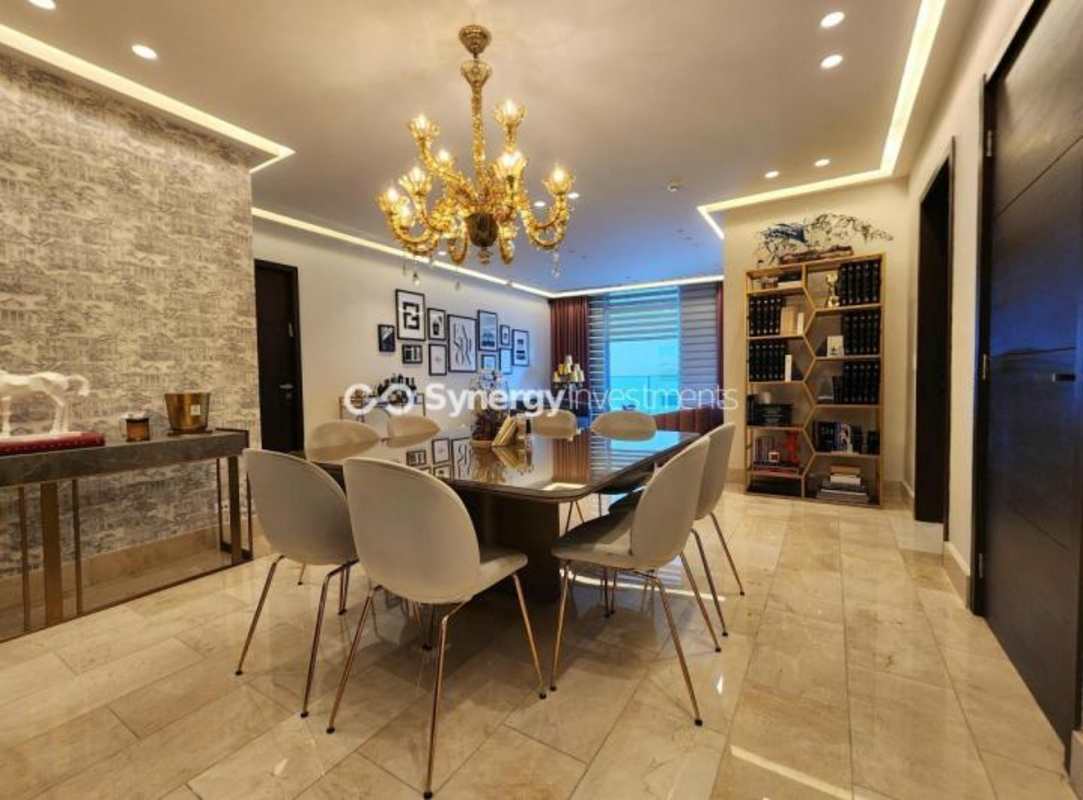 Elegant dining room with art gallery style decor in PH Ocean Riviera Punta Pacifica