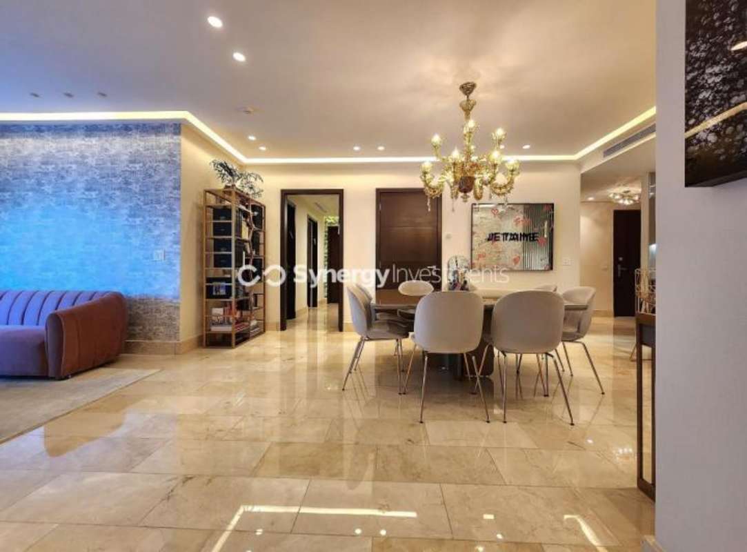 Living room with chandelier marble floors modern decor PH Ocean Riviera Punta Pacifica Panama