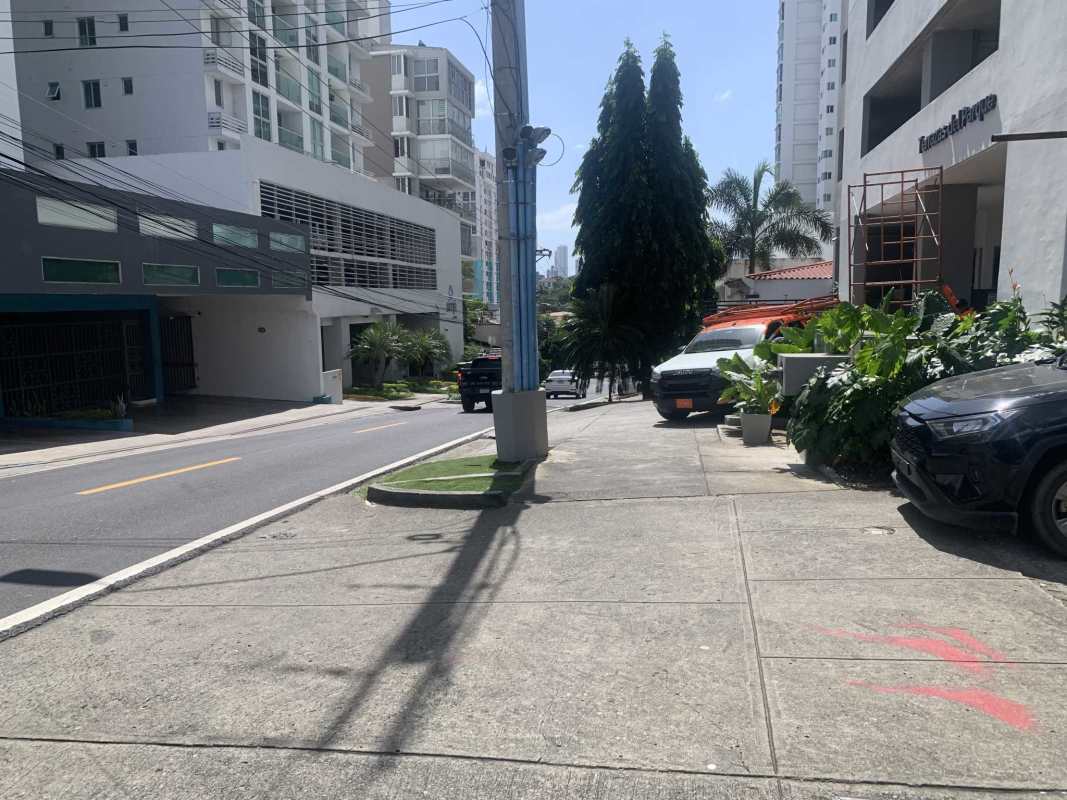 Modern high-rise apartments and city street opposite Panama land for sale in Parque Lefevre