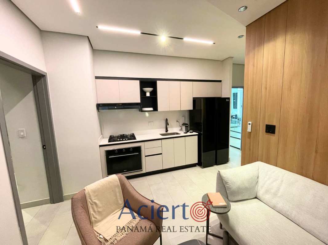 Open modern kitchen with living area in new Park Square Bloom Tower condo Panama