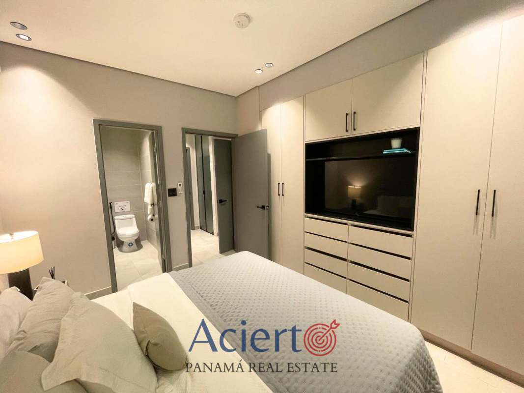 Rooftop outdoor kitchen with seating and glass canopy in Park Square Vía España