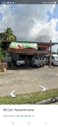 Roadside commercial lot with two-story structure, open yard and storage space along Panamericana Highway in Bejuco Panama